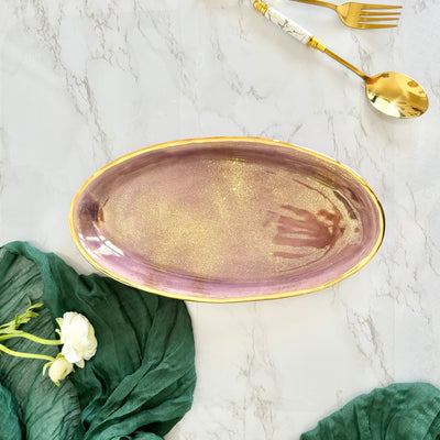 purple plater with gold flatware