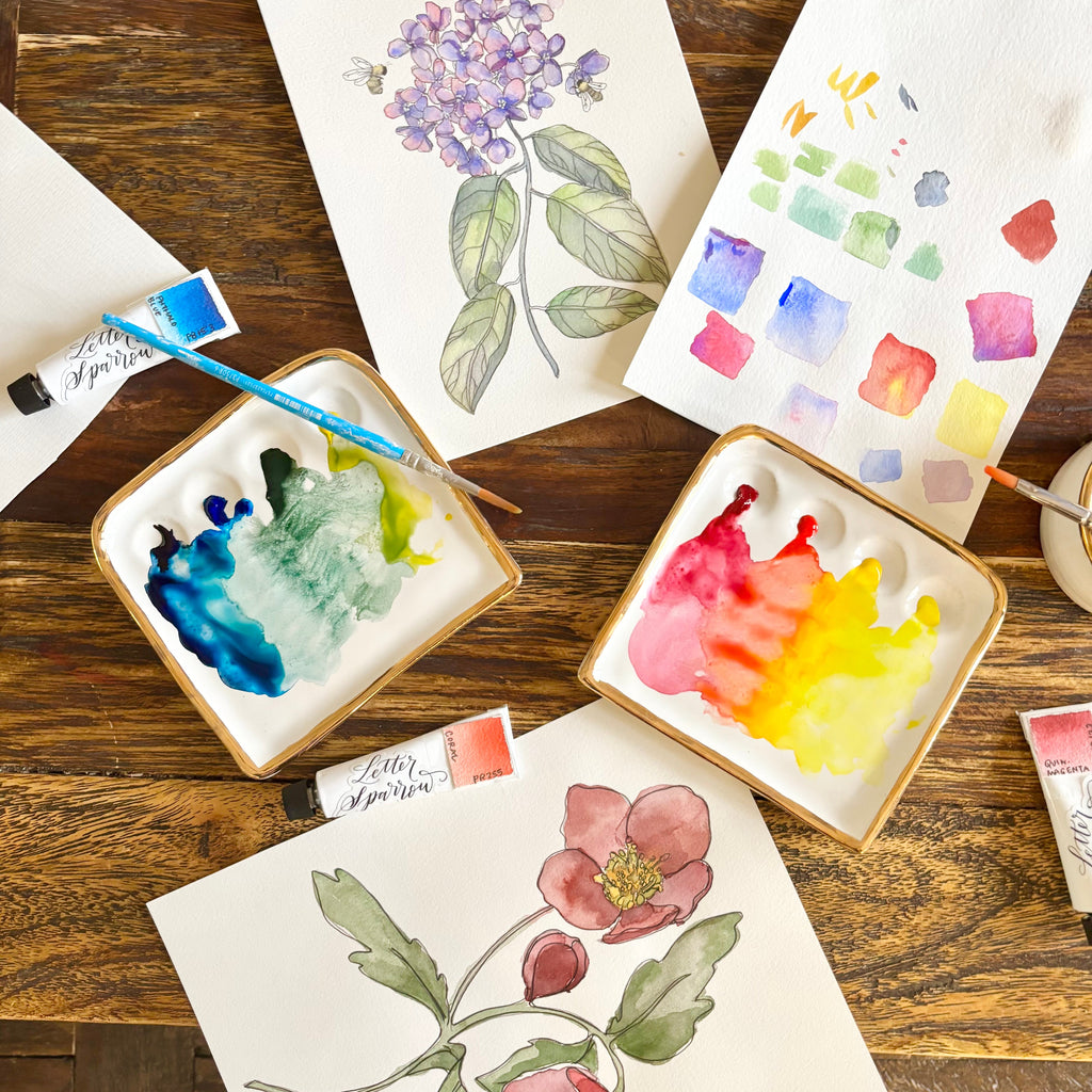 Another overhead view of "The Kris Palette". This image features two Kris palettes in use, one with cool-toned paints, and the other with warm-toned paints.