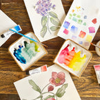 Another overhead view of "The Kris Palette". This image features two Kris palettes in use, one with cool-toned paints, and the other with warm-toned paints.