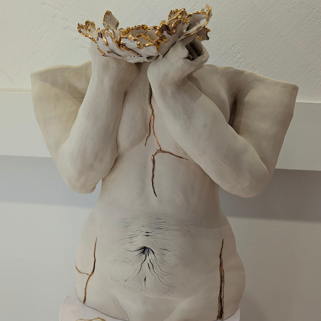 A close-up view of the whole sculpture, "She Who Holds".