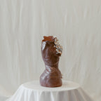 A side view featuring the right side of "She Who Remains".