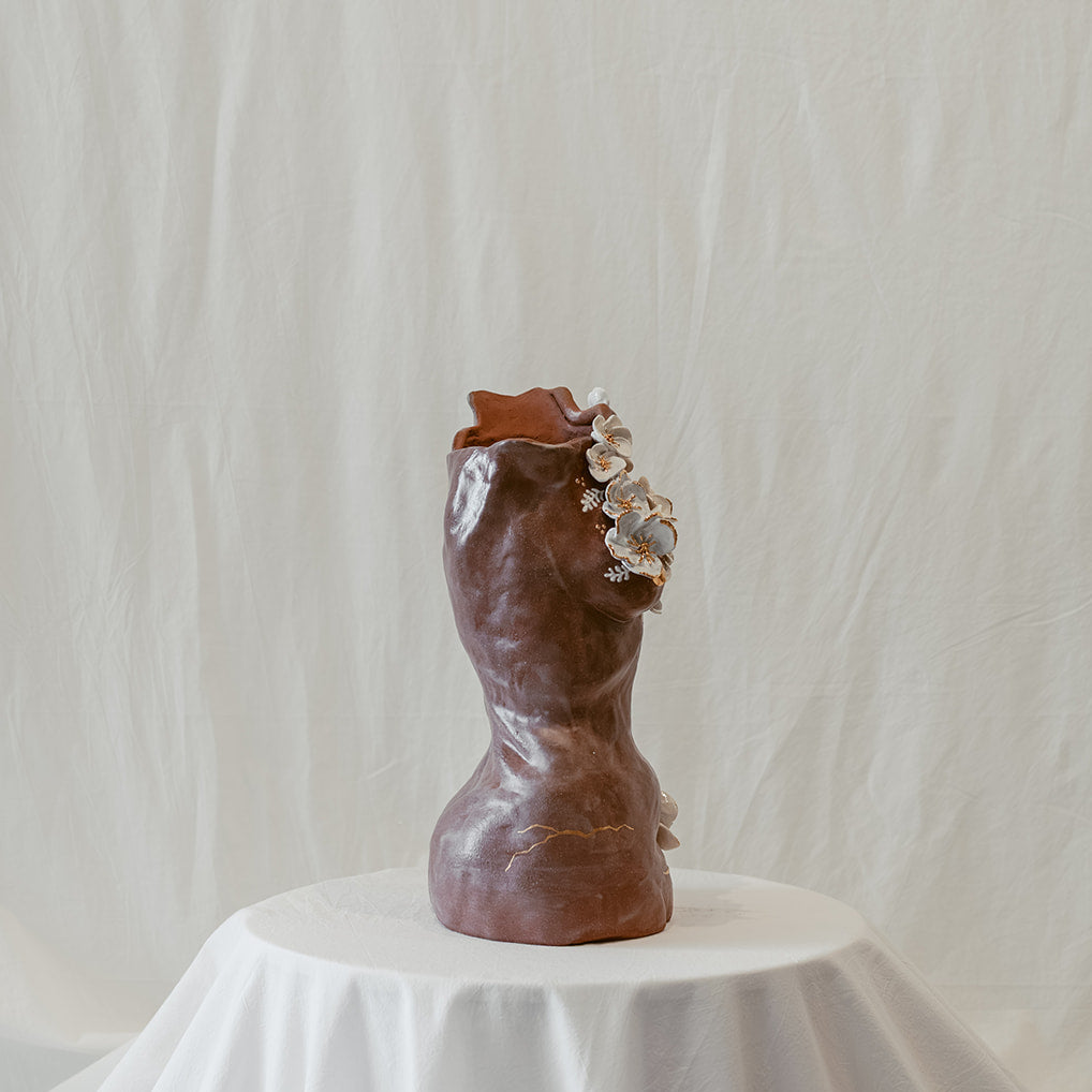 A side view featuring the right side of "She Who Remains".
