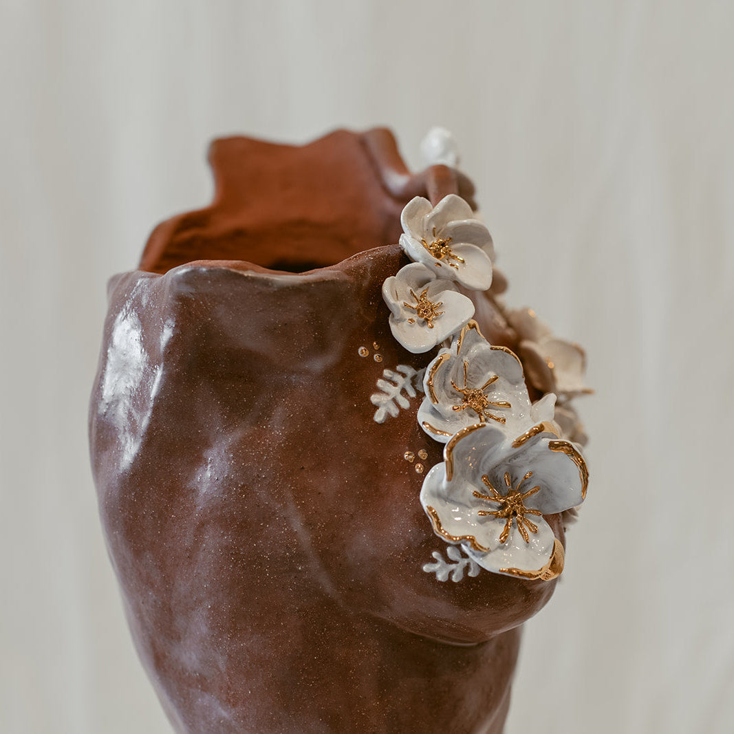 A close up view of the floral elements on "She Who Remains".