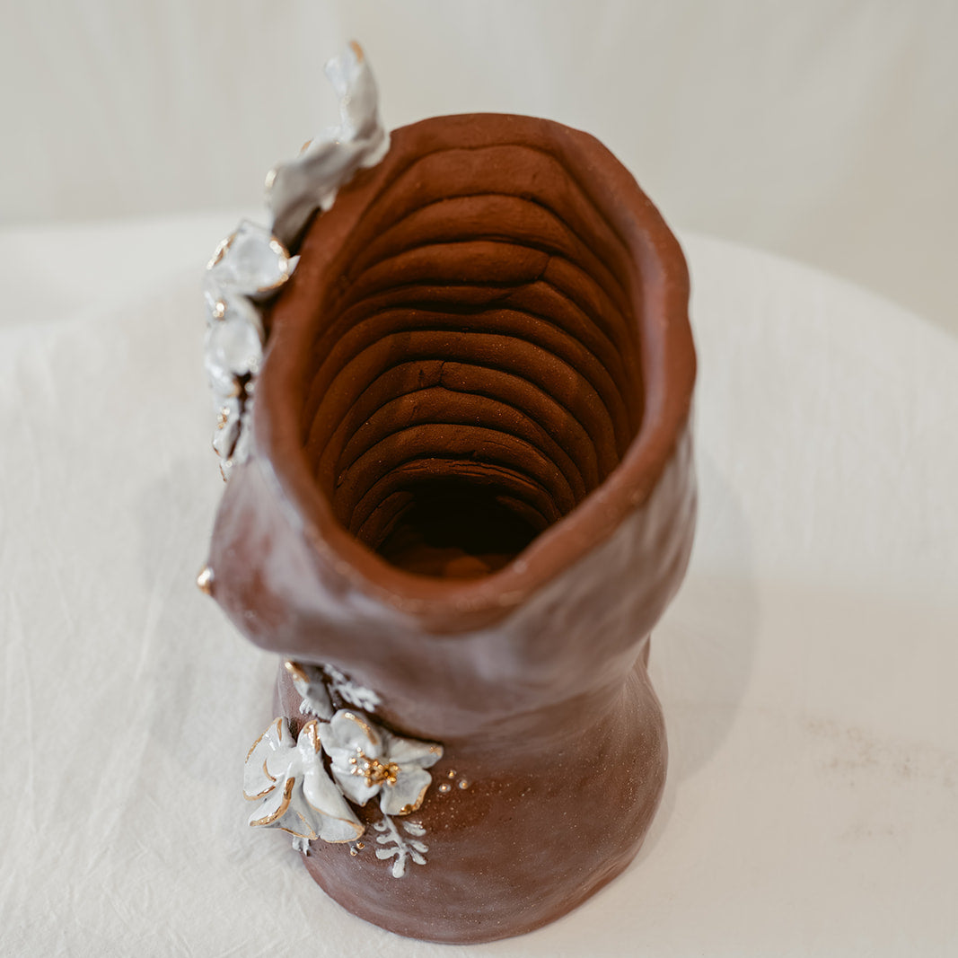 A bird's-eye view of "She Who Waits" featuring the coiling method of sculpting used to create the piece.