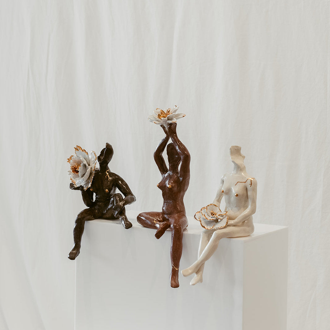 An off-center view featuring the left side of "She Who Gathers".