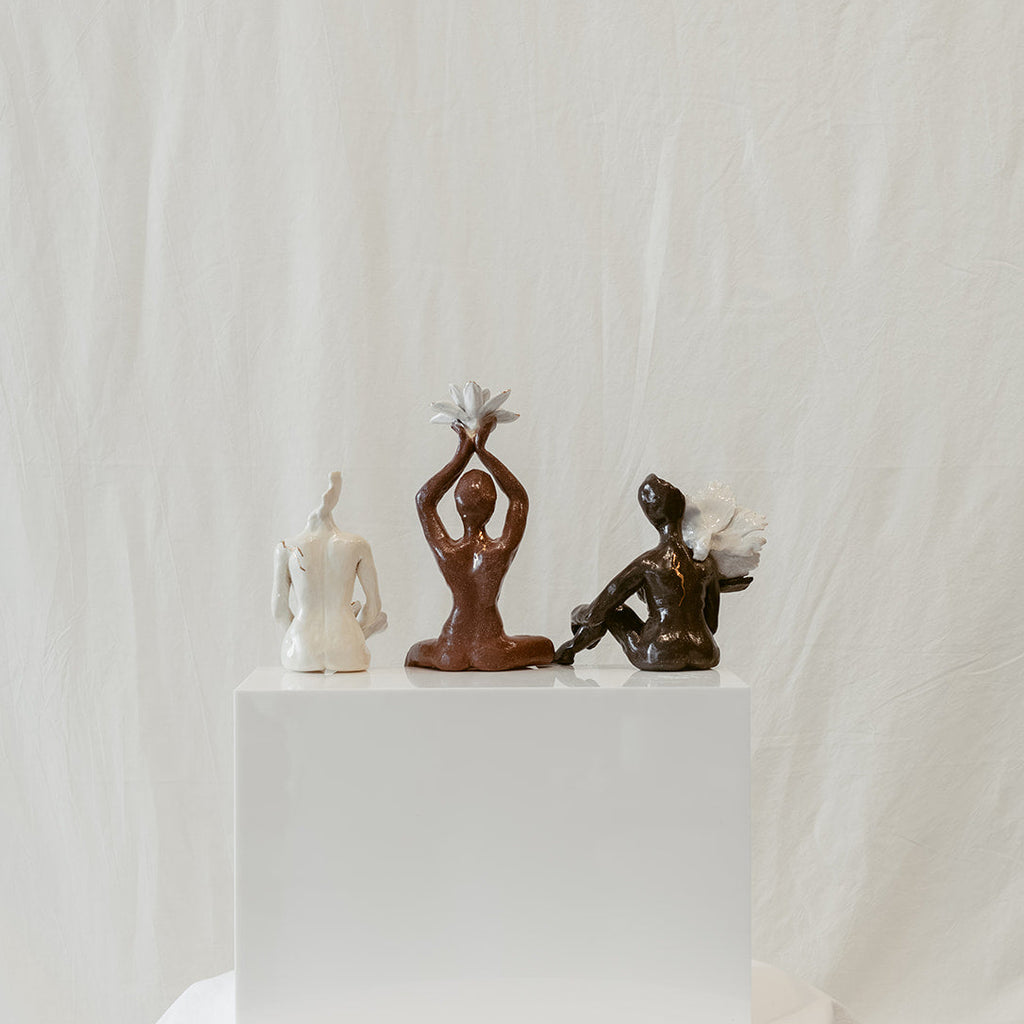 A straight-on view featuring the back of the piece: "She Who Gathers".