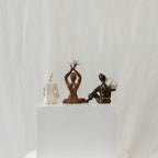 A straight-on view featuring the back of the piece: "She Who Gathers".