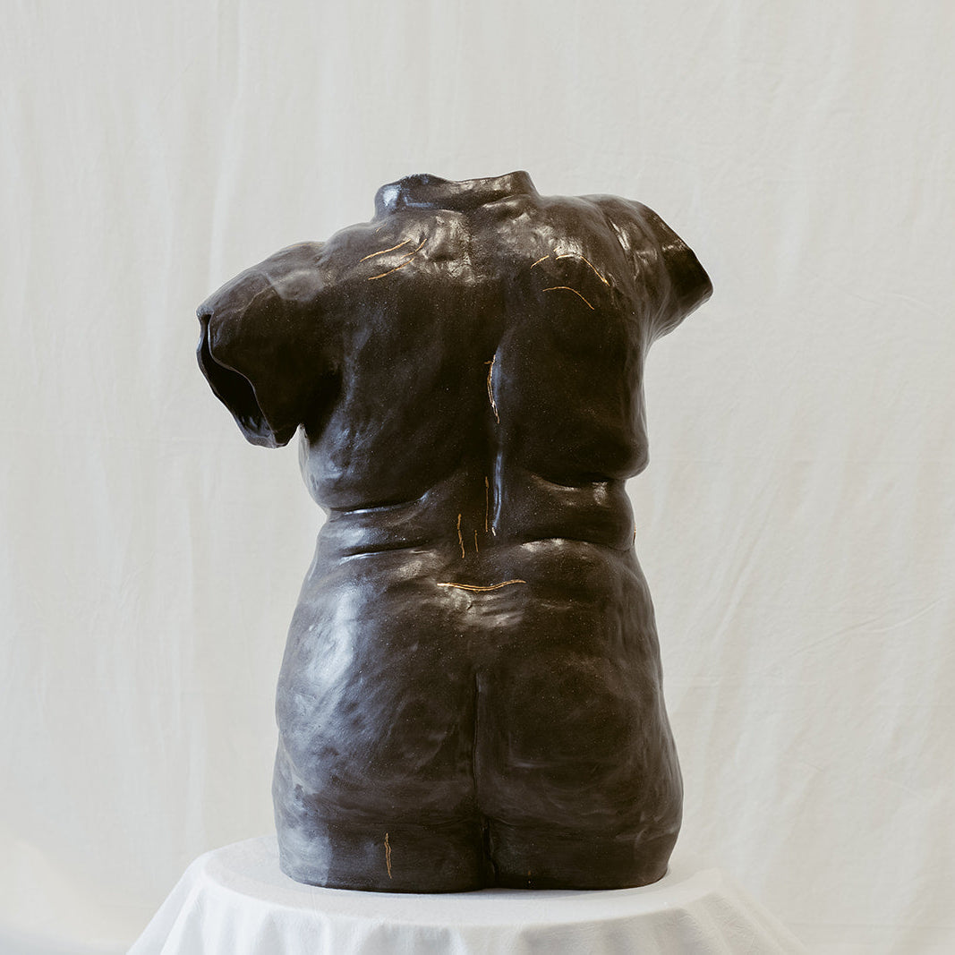 A complete back view of "She Who Feels".