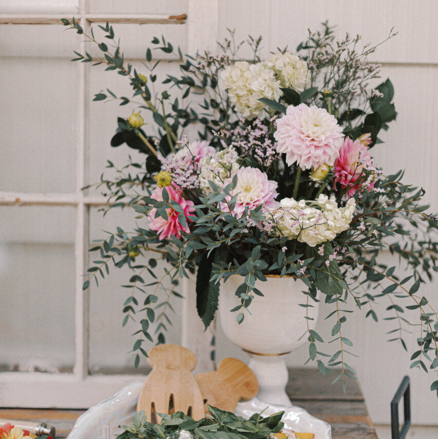 Different floral arrangement in the compote vase