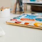 An angled side view of a painter's palette.