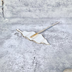 A side angle view of "The Imogene Brush Rest".
